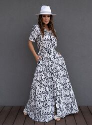 Чорно-біла приталена сукня з воланом