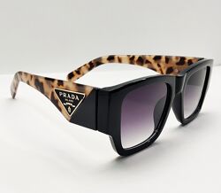 Жіночі окуляри сонцезахисні із леопардовими широкими дужками