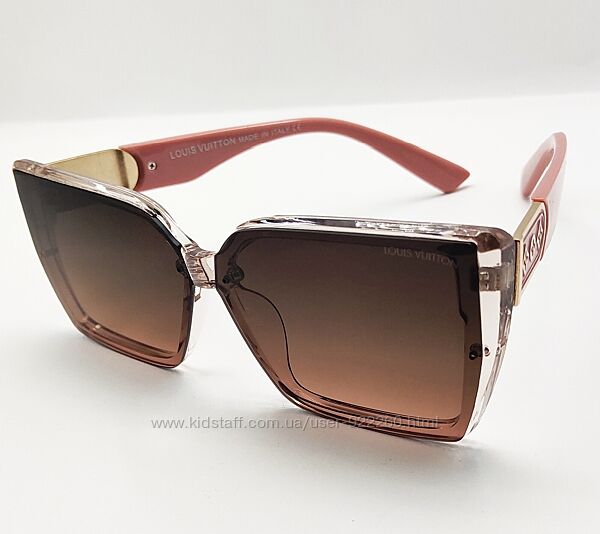 Сонцезахисні жіночі окуляри в прозорій коричневій оправі та пудровими дужка