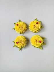 Яскраві резиночки для волосся з кульбабками.