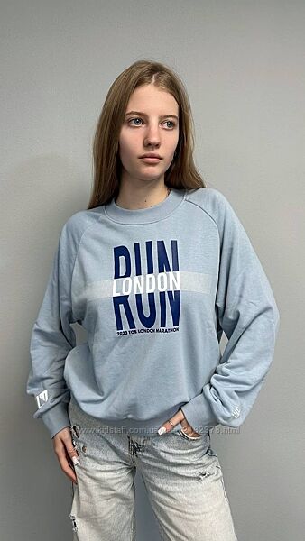 Світшот New Balance RUN LONDON, блакитний, жіночий